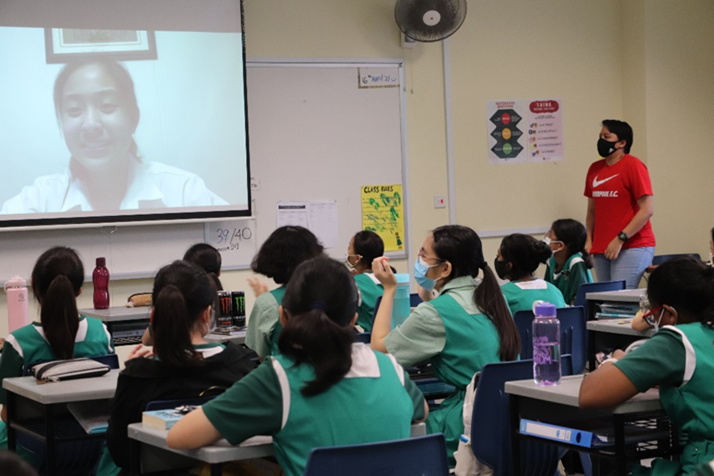 TKGians attending a classroom video conference with a guest speaker, facilitated by a staff member.